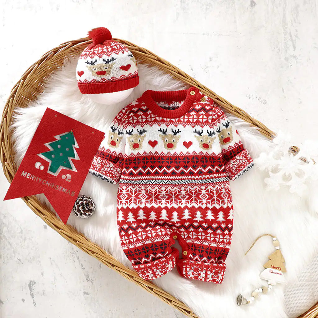 Velaflare red Christmas knit newborn romper and hat set flat-laid with holiday props.