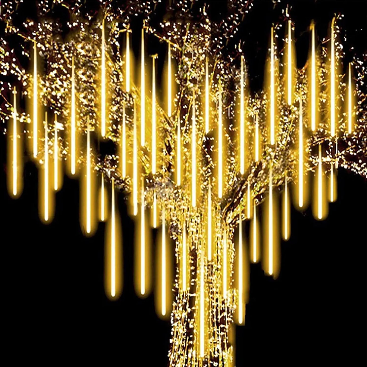 Velaflare LED meteor shower string lights glowing warmly on a garden tree, creating a cozy festive atmosphere outdoors.