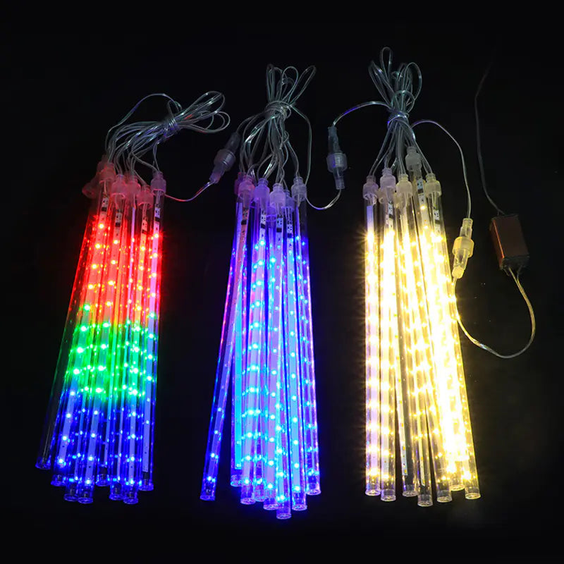 Multicolor Velaflare LED meteor shower lights shining in red, blue, and yellow hues for vibrant holiday décor.
